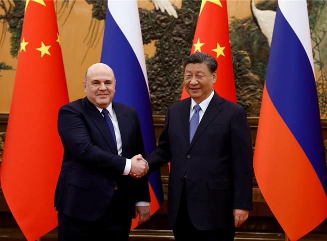 大陸國家主席習近平20日上午在北京人民大會堂會見俄羅斯總理米舒斯京。（路透）