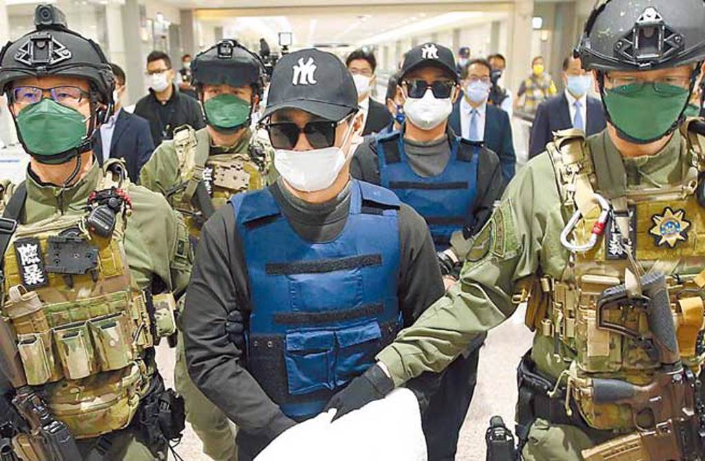台南學甲槍擊案主謀洪政軍（前排中）。（本報資料照片）