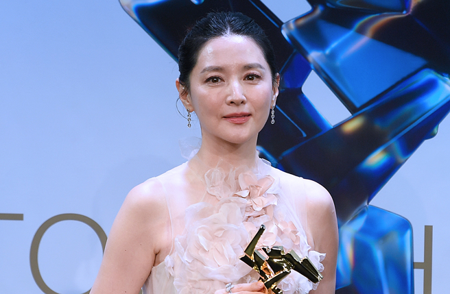 李英爱出道就与刘德华拍广告。（图／新华社）