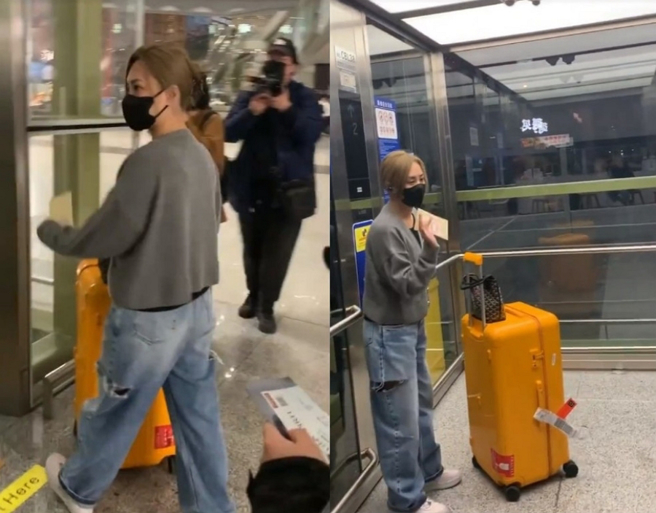 阿嬌在其他粉絲保護下平安進到電梯裡面。（圖／摘自東網）