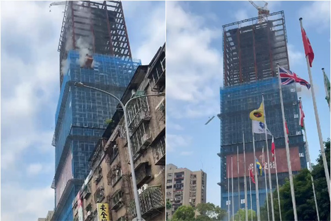 強震猛搖！北市信義區大樓「吊臂高空墜落」 砸中對面大樓。(翻攝畫面)