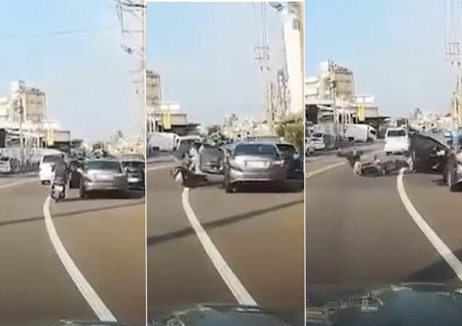 骑士骑车被路边停车的驾驶，开车门击落，人车喷到对向车道。（翻摄爆料公社）