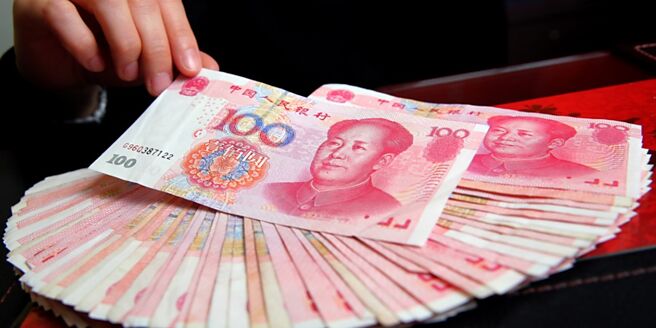 加快人民币国际化，人行提出包括深化金融市场开放、支持离岸人民币市场发展等五项措施。图／本报资料照片