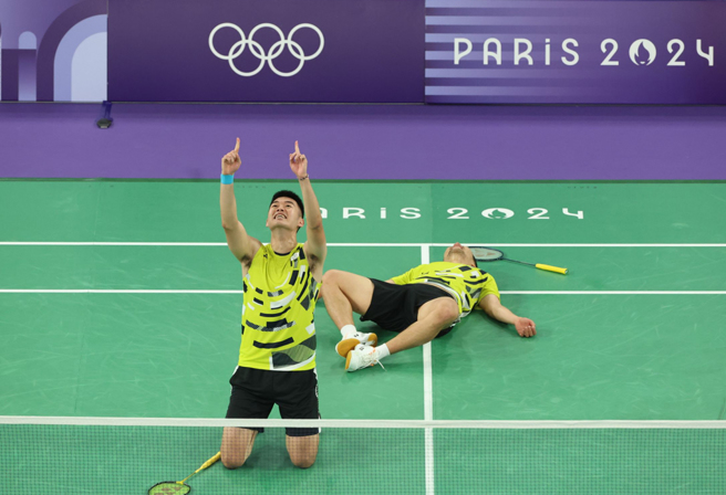 「麟洋配」苦战3局，成就奥运男双二连霸，教练团功不可没。（中时奥运採访团摄）