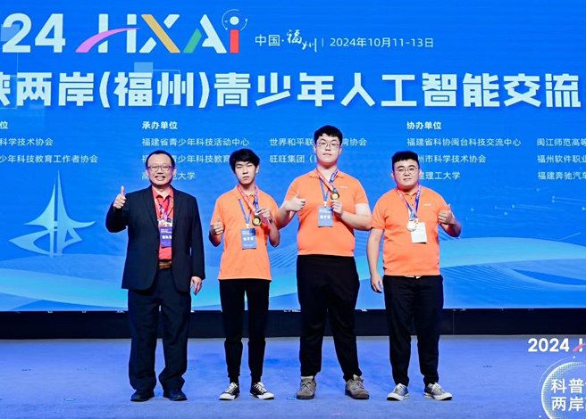 指导老师郭胜煌与「居家灭火机器人」团队。(照片/龙华科技大学提供)