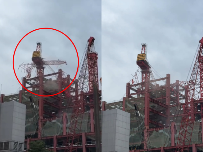 新北市三重区五谷王南街旁的工地，今（22）日上午发生工安意外，位在高楼的2座塔式起重机，突然从高空掉落。（民眾提供）