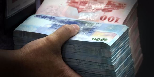 受害者誤以為中了大獎，配合詐團指示「創造金流」，損失逾50萬元。（資料照）