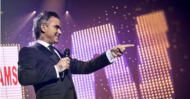 羅比威廉斯過去來台開唱時，在機場與媒體爆發衝突。（圖／台北双喜提供）