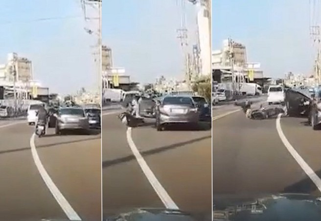 女騎士騎車被路邊停車的駕駛開車門擊落，人車噴到對向車道。（翻攝爆料公社）