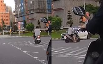 20秒遇天敵！騎士闖紅燈「慢慢滑」 警車突面前轉彎糗了
