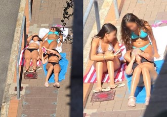 街頭驚現「比基尼女郎」 無視路人躺人行道日曬引熱議