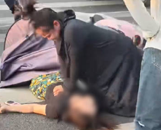 孕婦街頭救人！熱心片被PO上網 釣出本人澄清：未懷孕