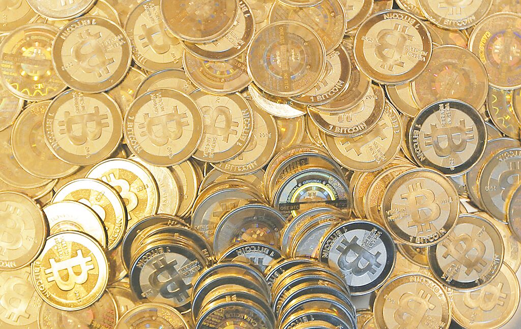 一項明顯的金融質變訊息，來自於沸沸揚揚的加密貨幣，挑戰現有的交易媒介型態。圖／美聯社