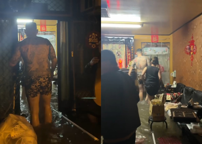 刺青猛男走进一处被水淹没的民宅，合力抬着阿嬷，将人安全地送上2楼。（翻摄网友@0423mark_）